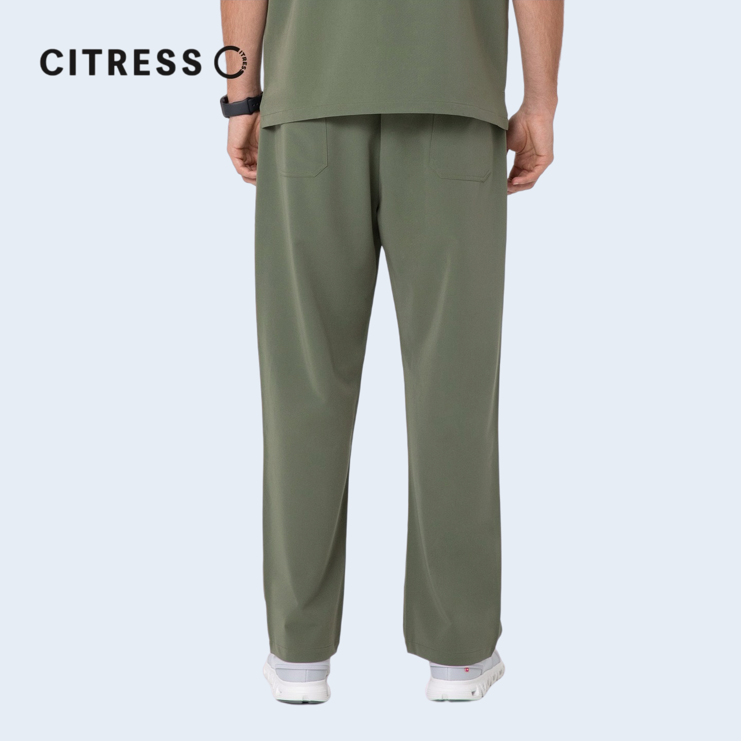 Waist and leg detail of CITRESS green scrub pants, with functional pockets