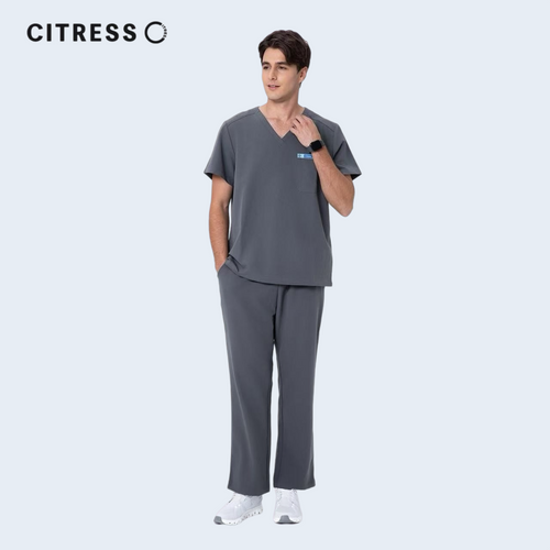 Male doctor wearing CITRESS grey scrub pants in hospital, professional medical workwear