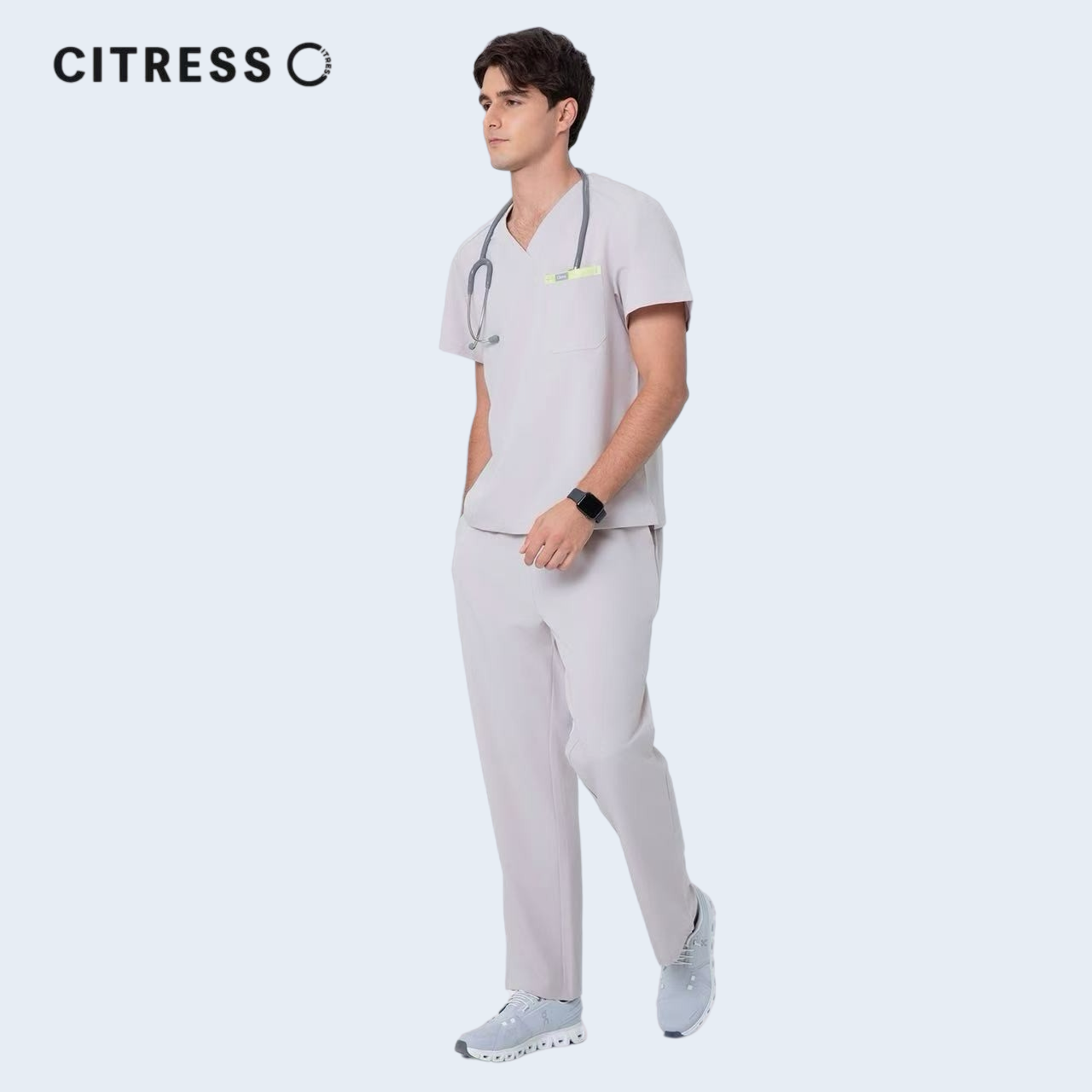 Male doctor wearing CITRESS khaki scrub pants in hospital, professional medical workwear