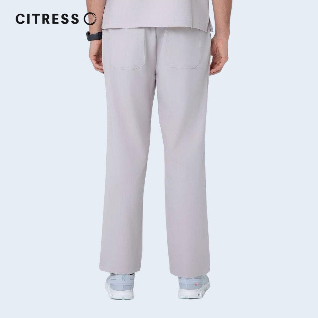 Waist and leg detail of CITRESS khaki scrub pants, with functional pockets