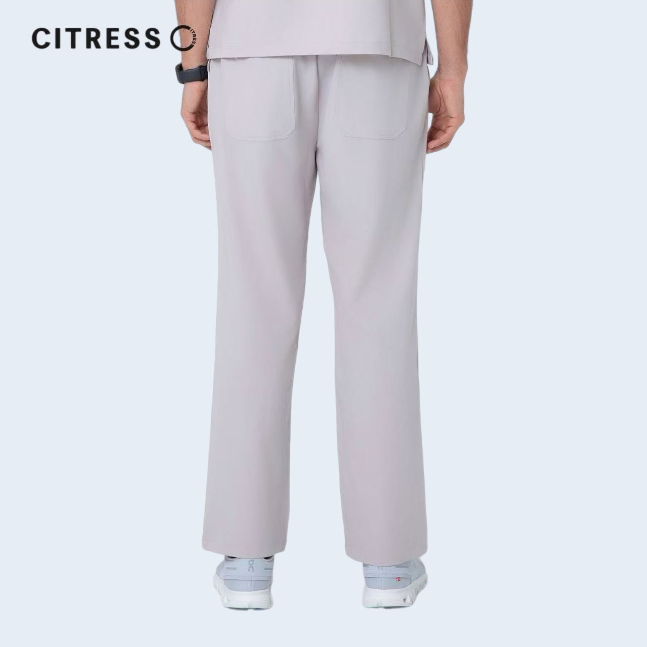Waist and leg detail of CITRESS khaki scrub pants, with functional pockets