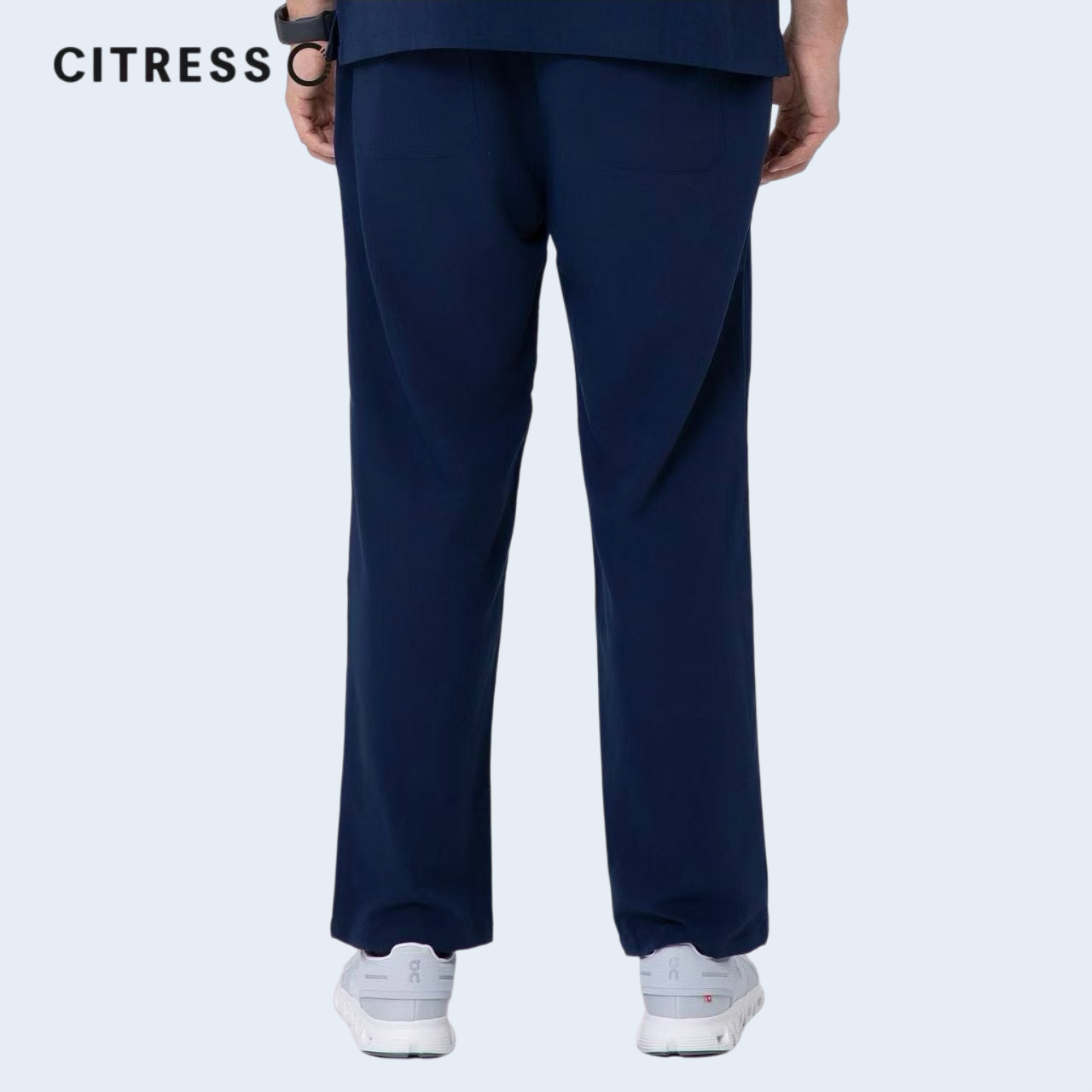 Waist and leg detail of CITRESS navy scrub pants, with functional pockets