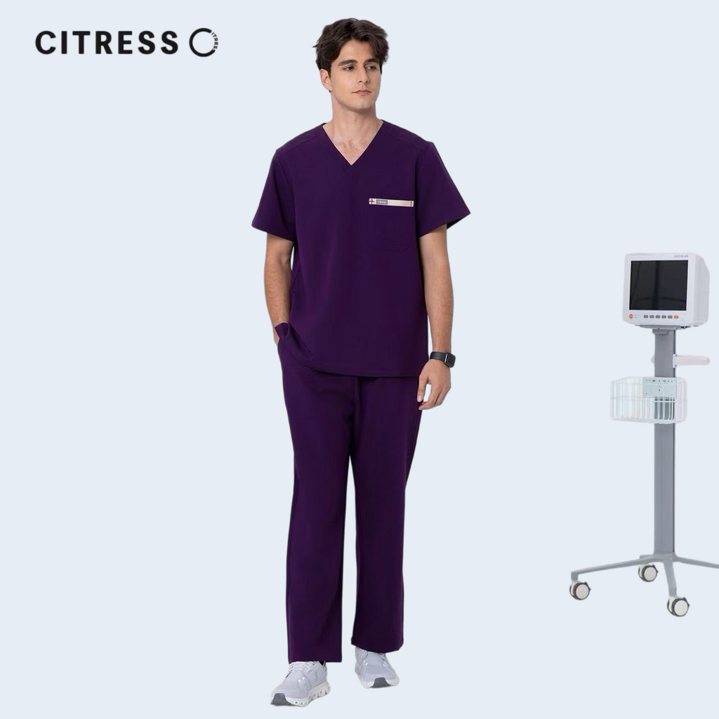 Male doctor wearing CITRESS purple scrub pants in hospital, professional medical workwear