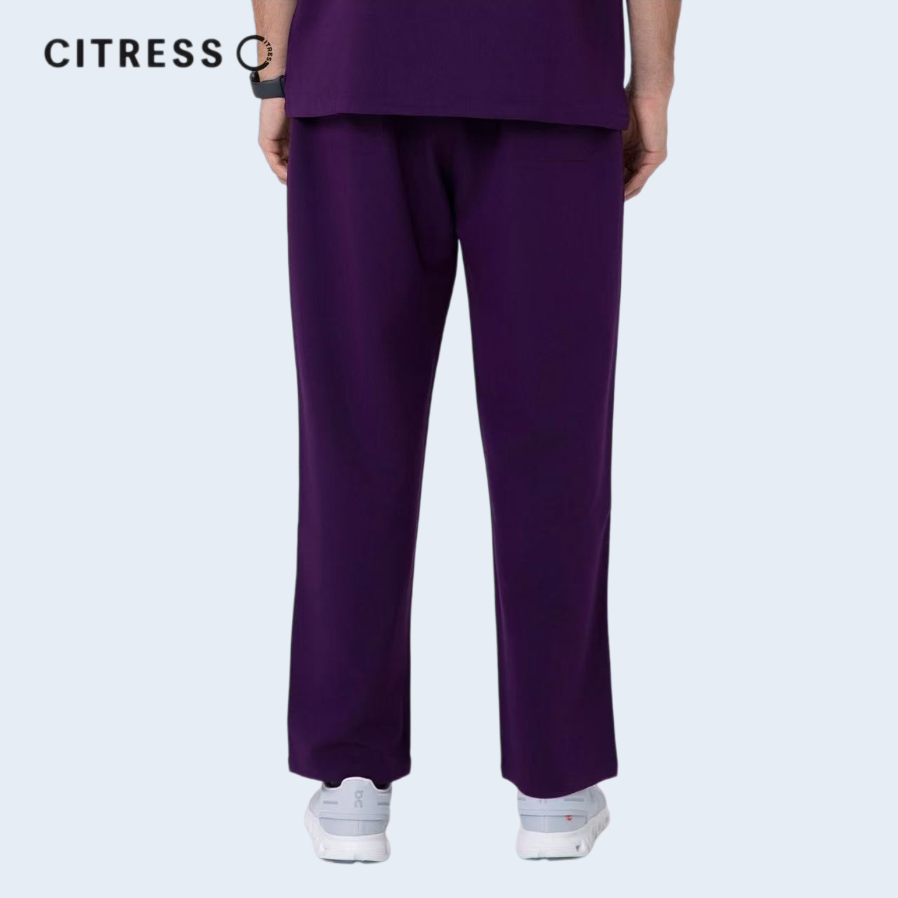 Waist and leg detail of CITRESS purple scrub pants, with functional pockets