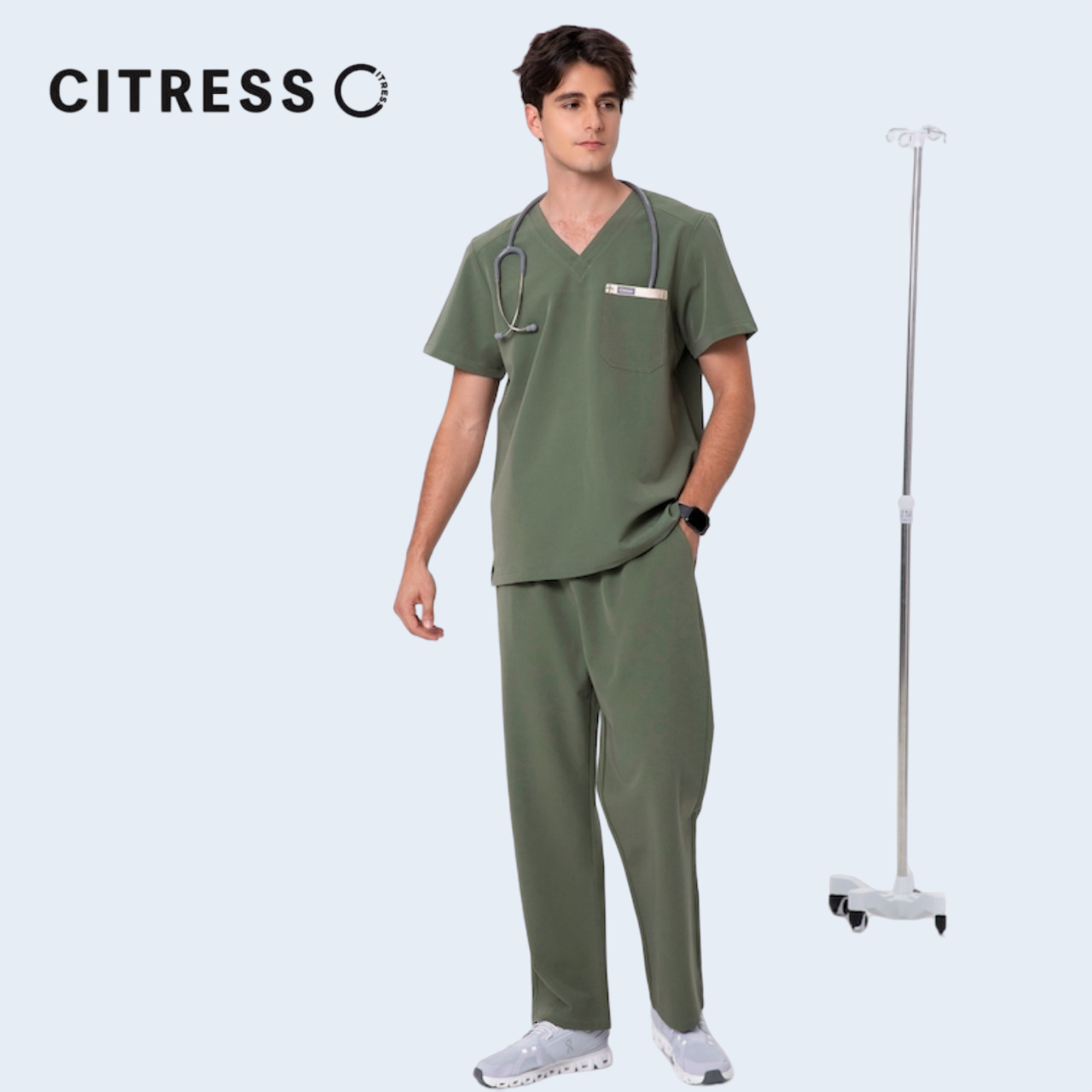 Male doctor wearing CITRESS green scrub set in hospital, professional medical workwear