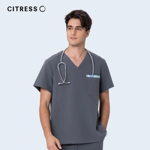 Male doctor wearing CITRESS grey scrub set in hospital, professional medical workwear