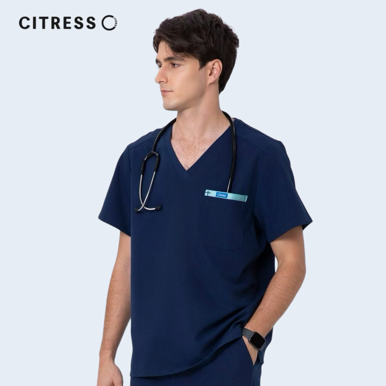 Front view of CITRESS men's navy scrub top, showing V-neck and functional chest pocket