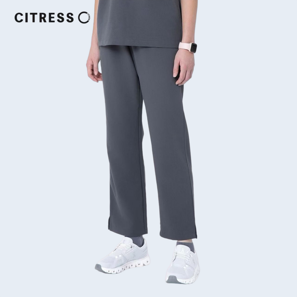 Side view of CITRESS grey scrub pants, showing straight leg fit and drawstring waist