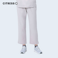 Side view of CITRESS khaki scrub pants, showing straight leg fit and drawstring waist