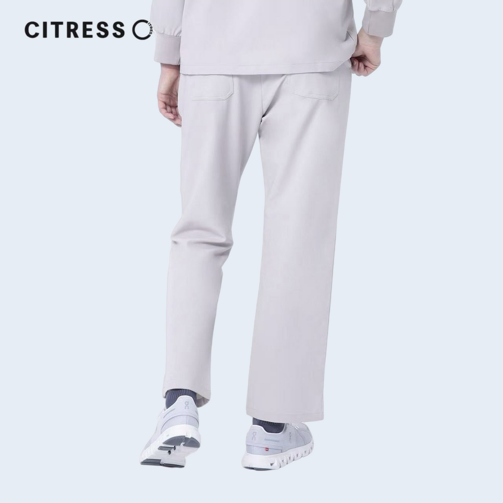 Waist and leg detail of CITRESS khaki scrub pants, with functional pockets