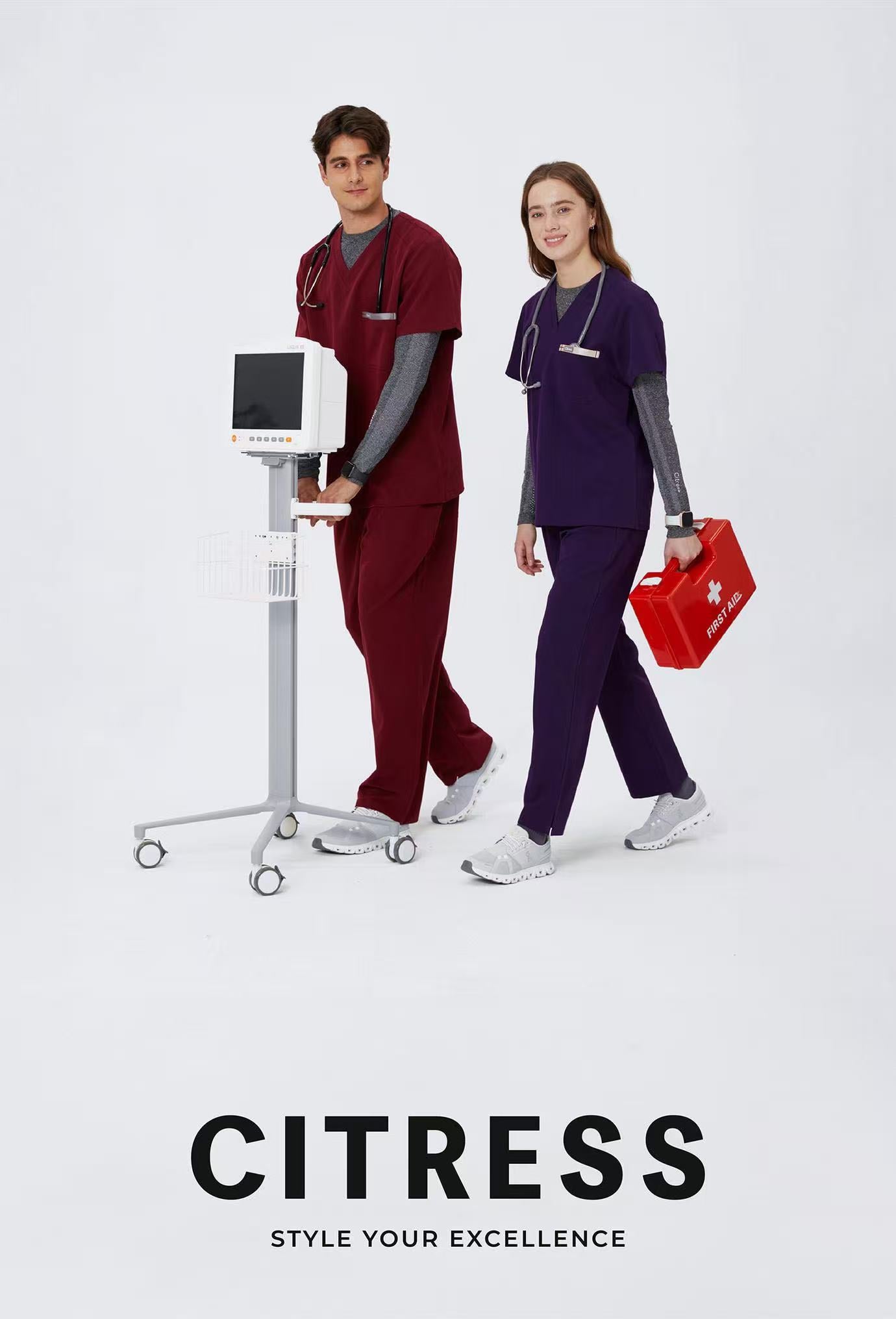 Healthcare team wearing CITRESS scrub sets in purple and grey colors