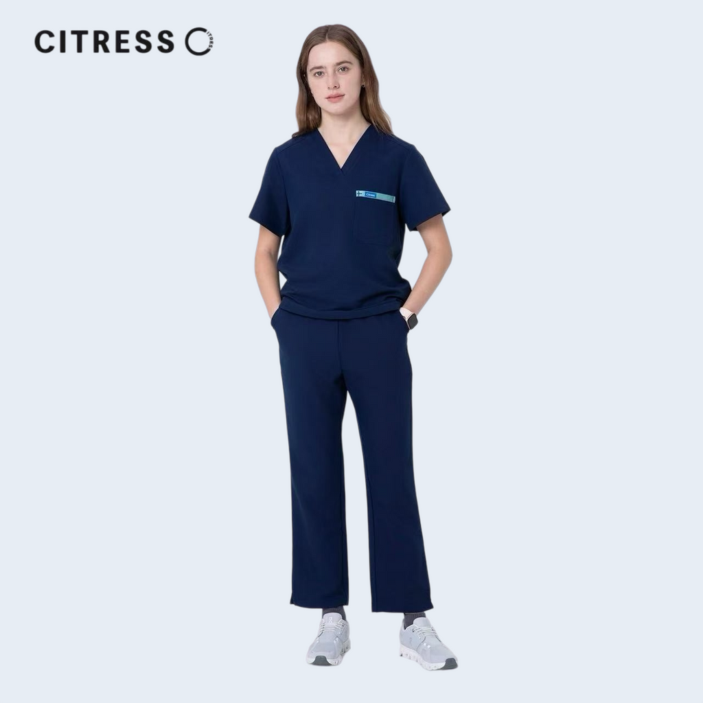 Nurse wearing CITRESS navy scrub pants in hospital, professional medical workwear