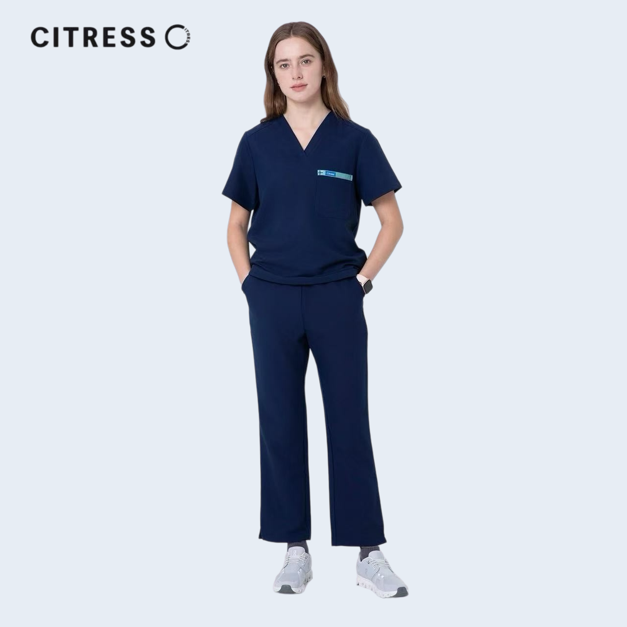 Nurse wearing CITRESS navy scrub pants in hospital, professional medical workwear