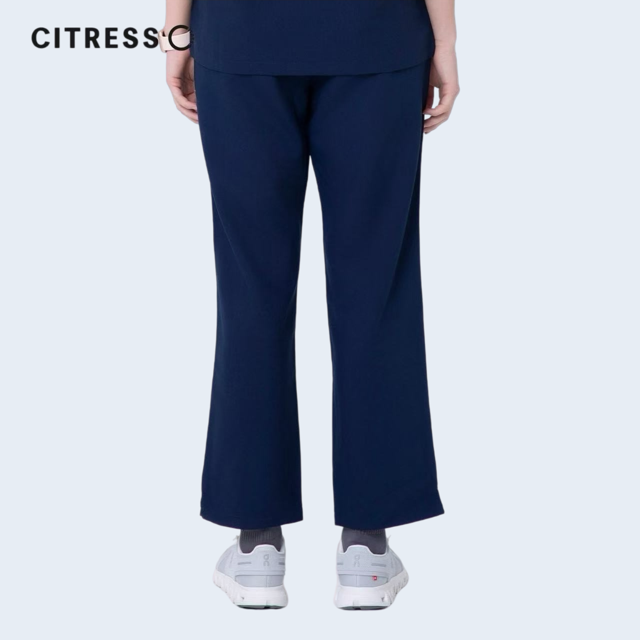 Waist and leg detail of CITRESS navy scrub pants, with functional pockets