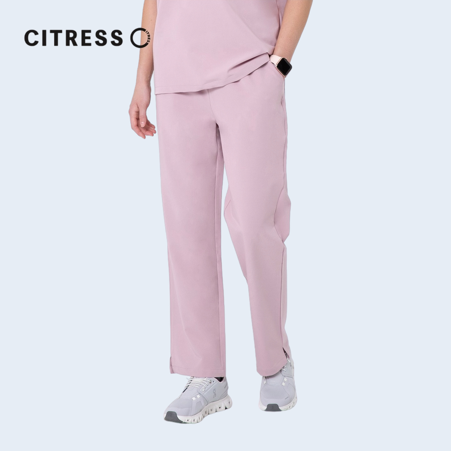 Side view of CITRESS pink scrub pants, showing straight leg fit and drawstring waist
