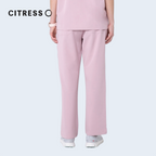 Waist and leg detail of CITRESS pink scrub pants, with functional pockets
