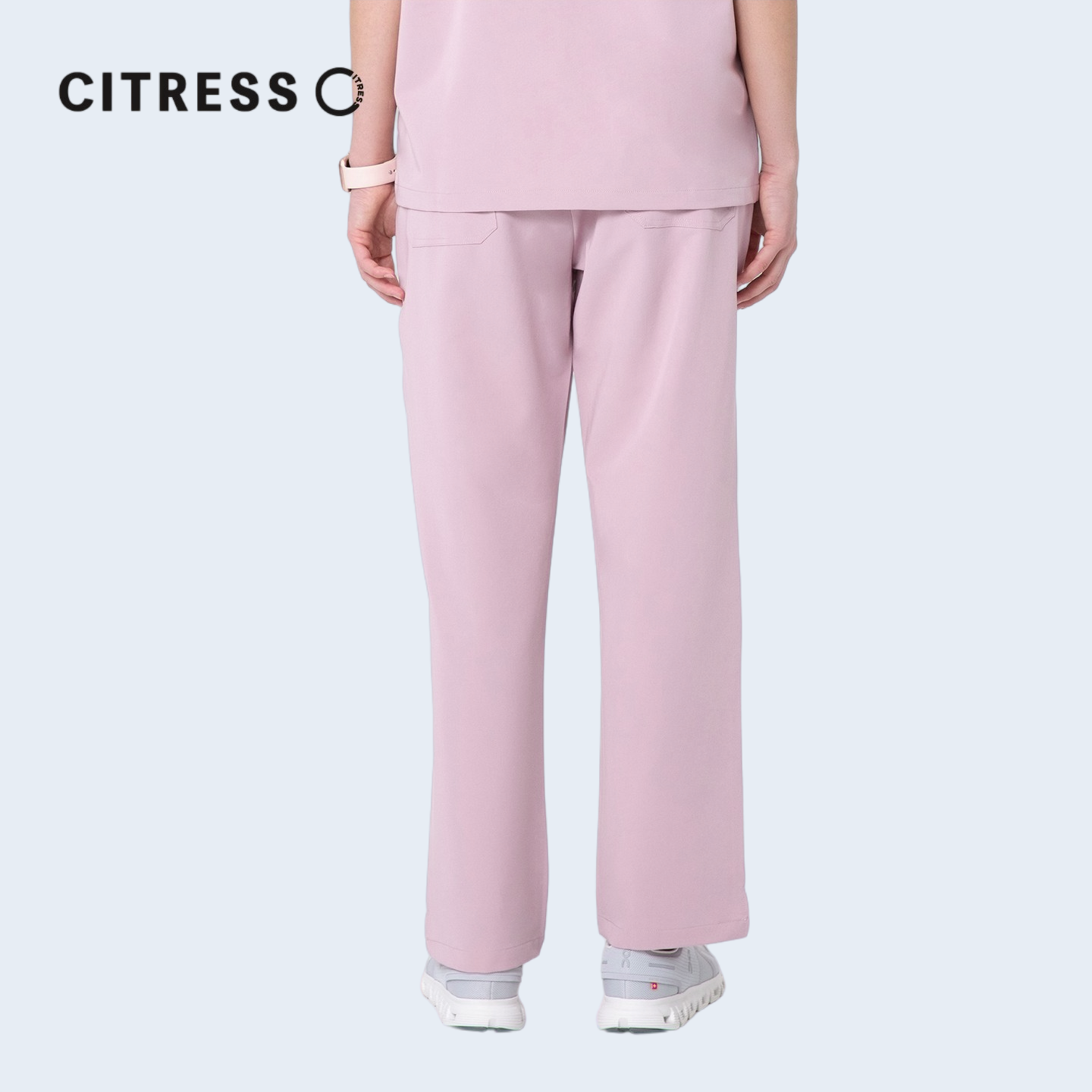 Waist and leg detail of CITRESS pink scrub pants, with functional pockets