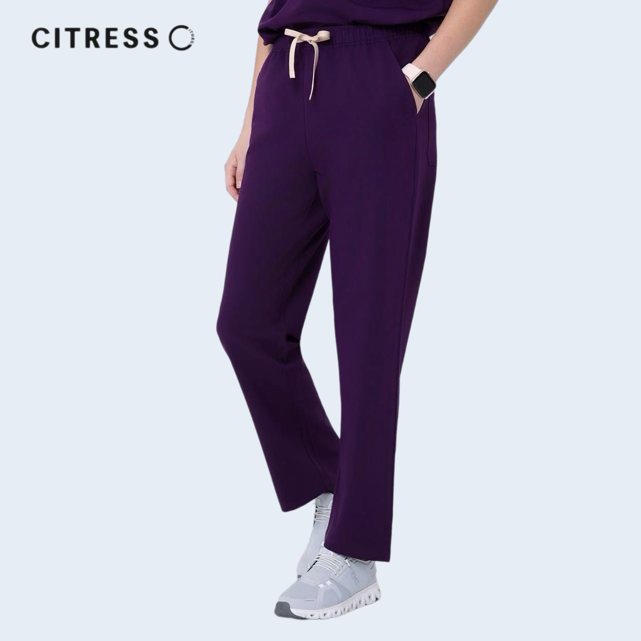 Side view of CITRESS purple scrub pants, showing straight leg fit and drawstring waist