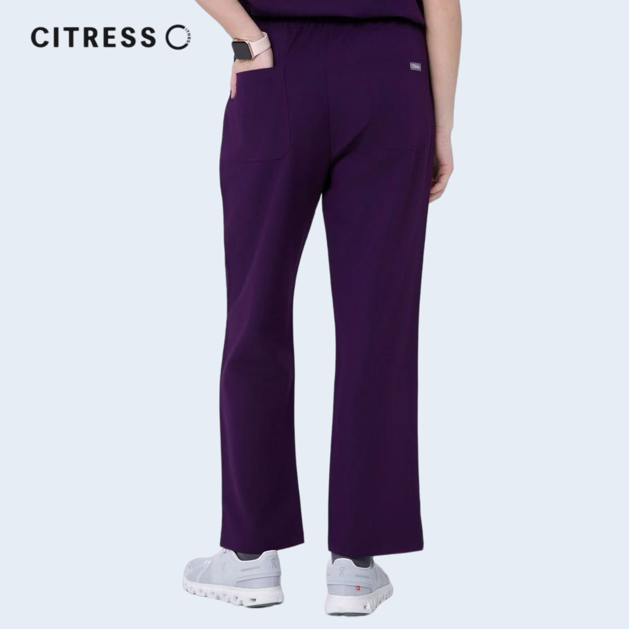 Waist and leg detail of CITRESS purple scrub pants, with functional pockets