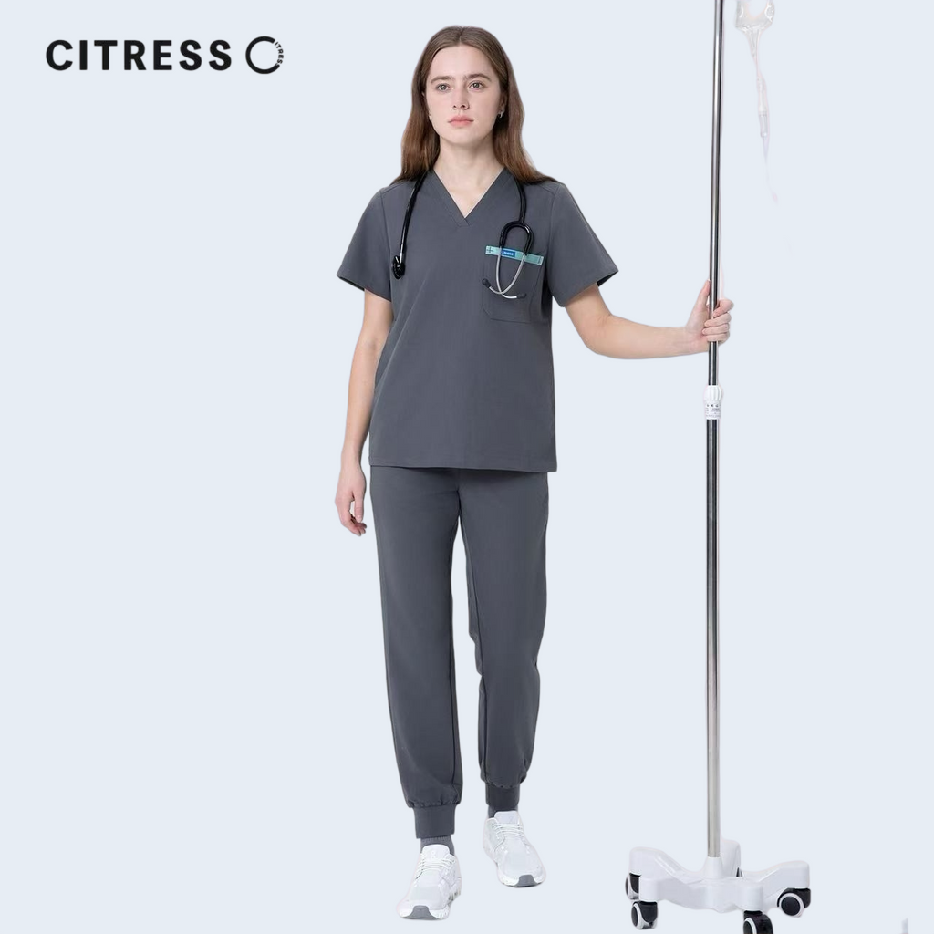 Nurse wearing CITRESS grey scrub set in hospital, professional medical workwear