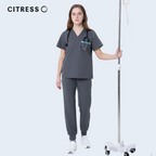 Nurse wearing CITRESS grey scrub set in hospital, professional medical workwear