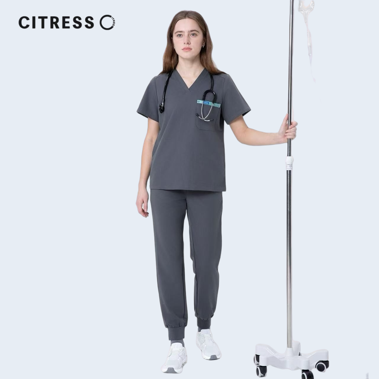 Nurse wearing CITRESS grey scrub set in hospital, professional medical workwear