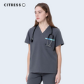 Front view of CITRESS grey scrub top, showing V-neck and chest pocket