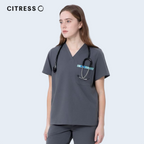 Front view of CITRESS grey scrub top, showing V-neck and chest pocket