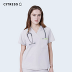 Front view of CITRESS khaki scrub top, showing V-neck and chest pocket