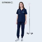 Nurse wearing CITRESS navy scrub set in hospital, professional medical workwear