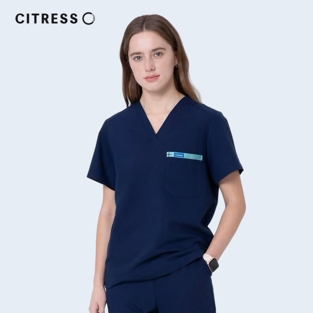 Side view of CITRESS women's navy scrub top, soft stretch fabric
