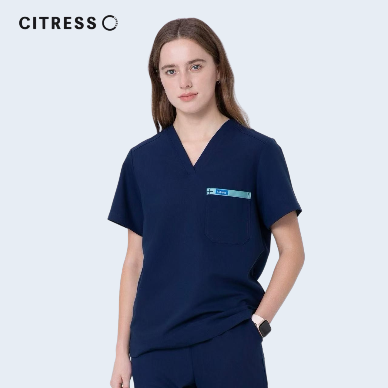 Side view of CITRESS women's navy scrub top, soft stretch fabric