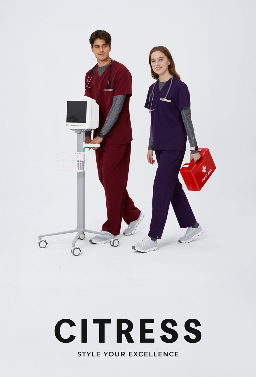 Healthcare team wearing CITRESS scrub sets in grey and maroon colors