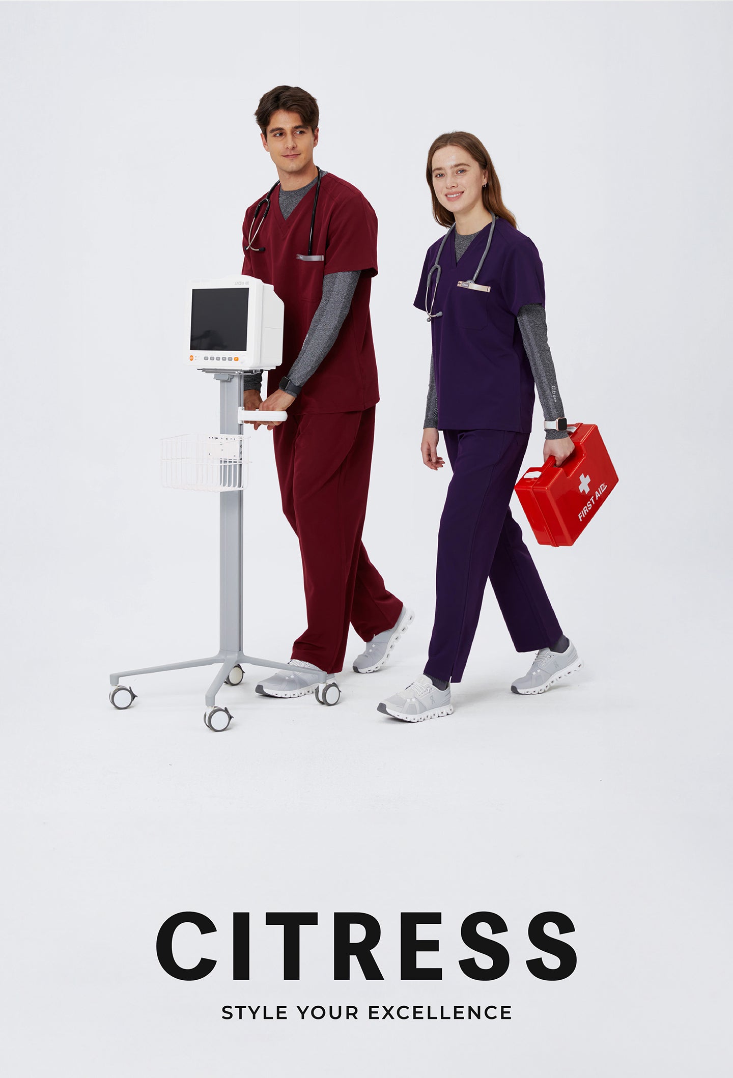 Healthcare team wearing CITRESS scrub sets in grey and maroon colors