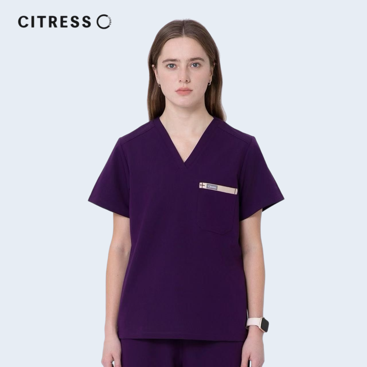 Front view of CITRESS purple scrub top, showing V-neck and chest pocket